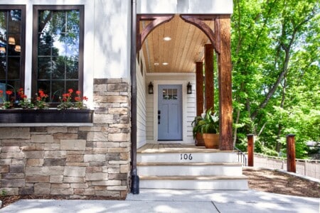 Front entrance porch and door of the Luxe DT Experience.