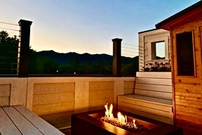 Relax in the evenings with a glass of wine around the fire table gazing up at the mountains.